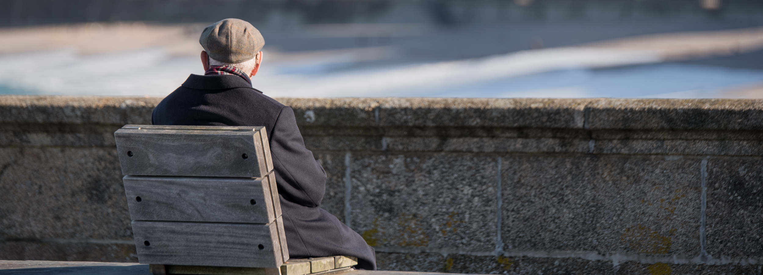 elderly man sat on a bench alone - undertakers croydon